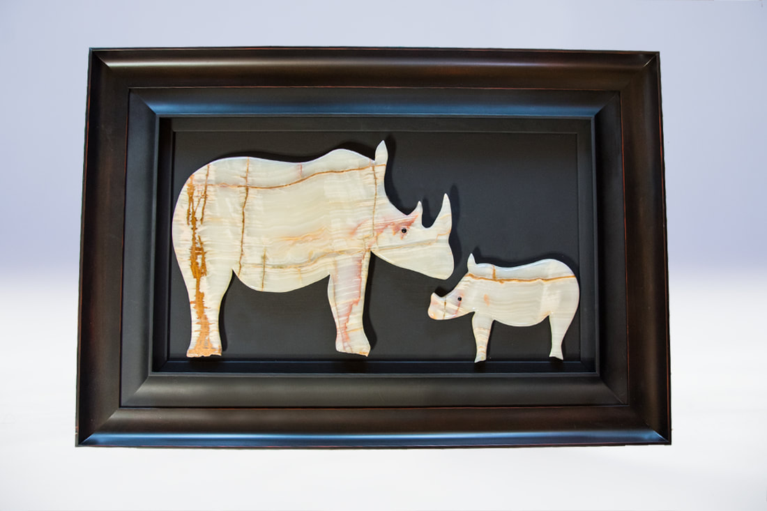 Bronze and onyx stone African rhino sculpture